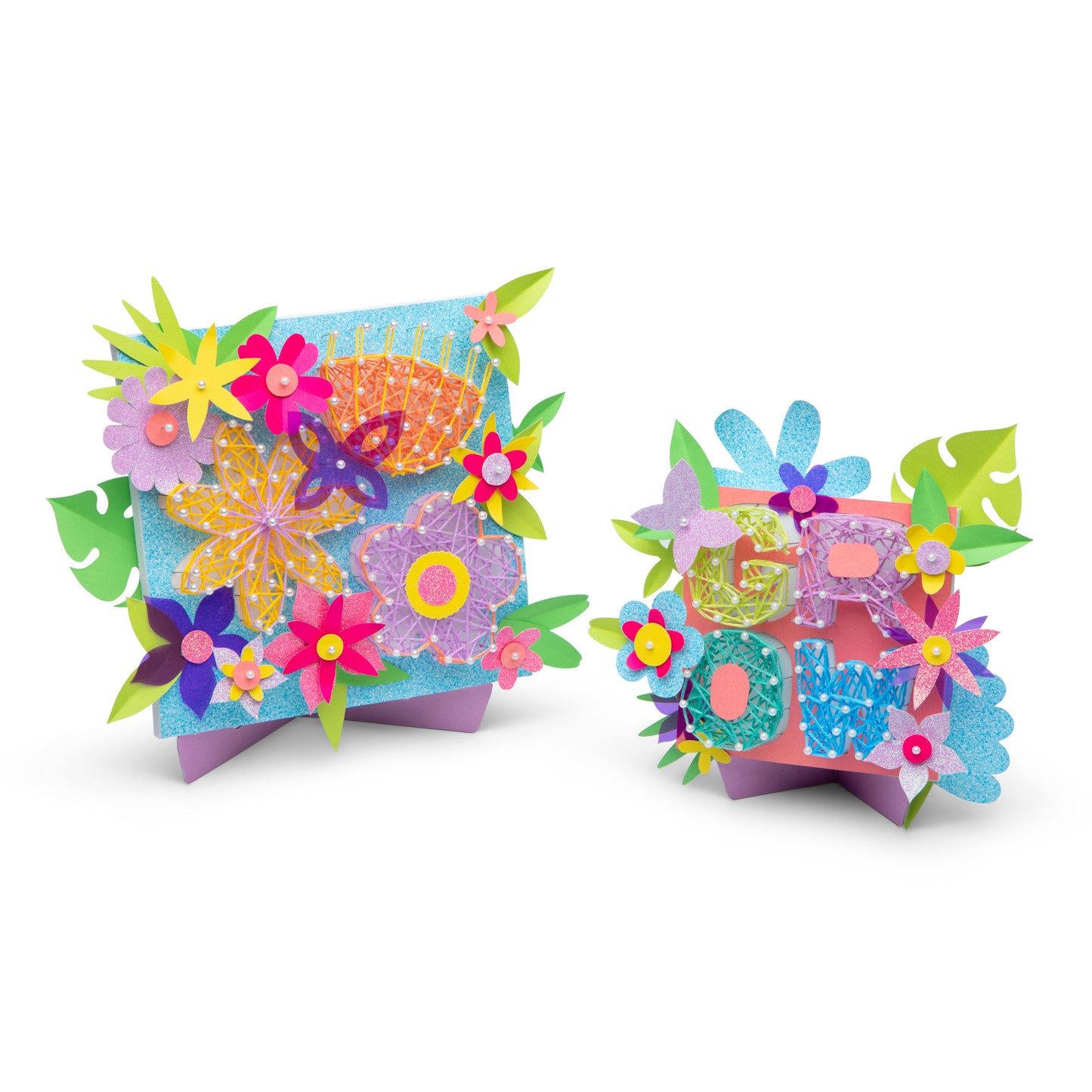 2 finished string art canvases displayed on easels.