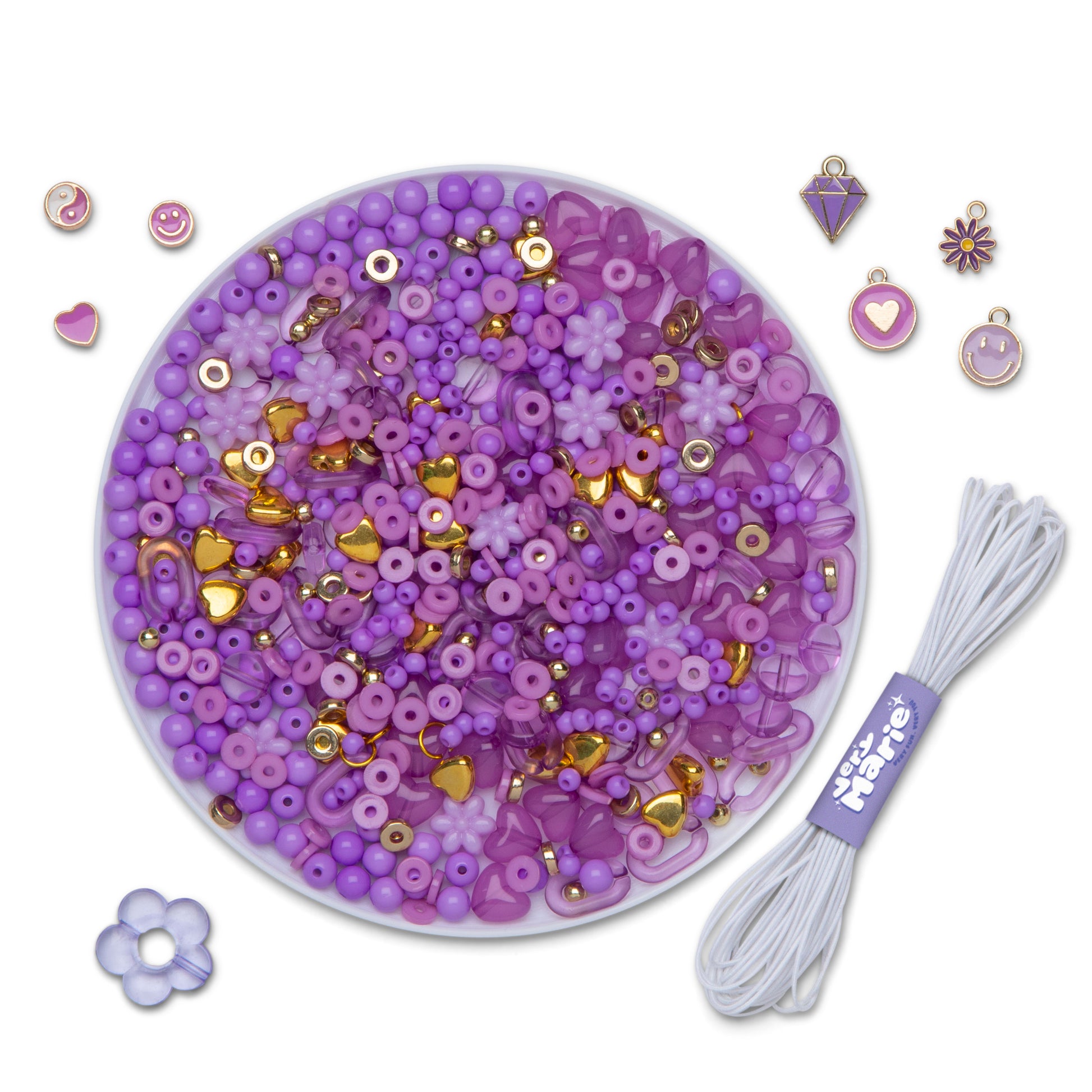 A circular dish full of purple and gold beads, next to a skein of elastic and metal charms and beads.