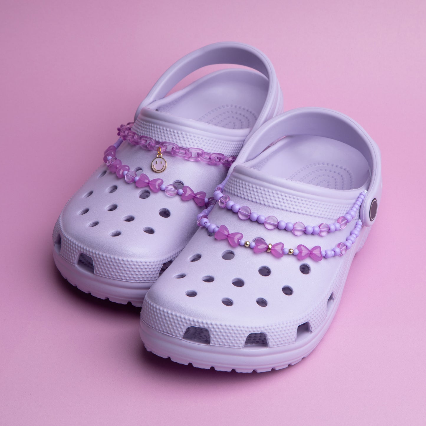 Garden clogs that have been decorated with beaded swags.