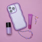 A phone case with a beaded handle and a lip gloss with a beaded tassel.